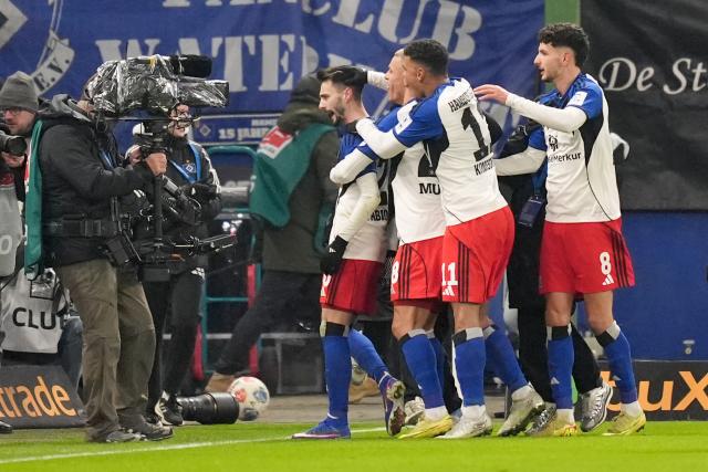 31 January 2026, Hamburg: Hamburger's Fabio Vieira celebrates scoring his side's first goal with teammates during the German Bundesliga soccer match between Hamburger SV and FC Bayern Munich at the Volksparkstadion Photo: Marcus Brandt/dpa