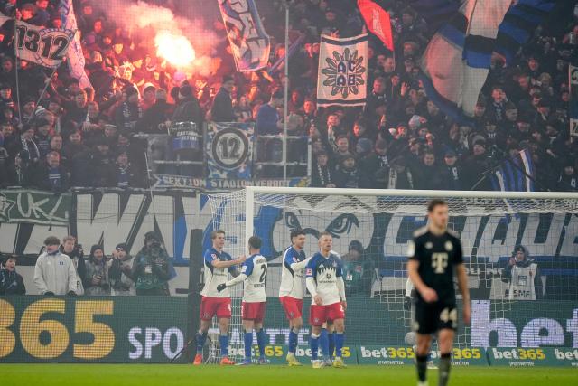 31 January 2026, Hamburg: Hamburger's Luka Vuskovic (L) celebrates scoring his side's second goal during the German Bundesliga soccer match between Hamburger SV and FC Bayern Munich at the Volksparkstadion Photo: Marcus Brandt/dpa - IMPORTANT NOTICE: DFL and DFB regulations prohibit any use of photographs as image sequences and/or quasi-video.