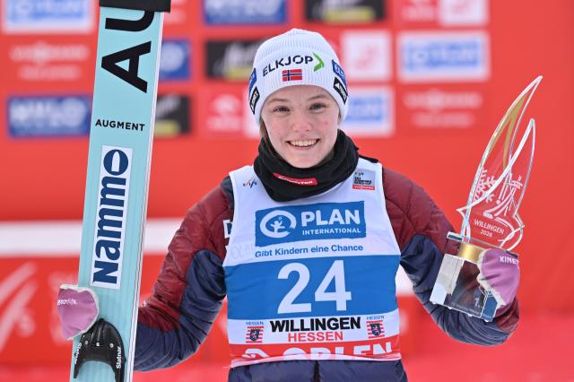 01 February 2026, Hesse, Willingen: Norway's Eirin Maria Kvandal celebrates with trophy after winning the women's Large Hill competition of the FIS Ski Jumping World Cup in Willingen. Photo: Swen Pförtner/dpa