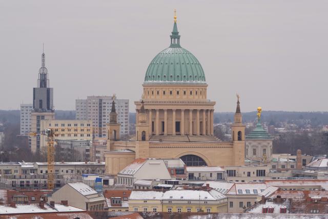 01 February 2026, Brandenburg, Potsdam: Snow covers the roofs around St. Nicholas Church in Potsdam. Photo: Georg-Friedrich Moritz/dpa
