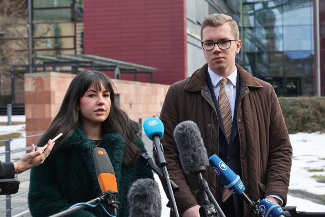 02 February 2026, Bavaria, Würzburg: AfD MP Daniel Halemba (R) stands with defense lawyer Isabella Sanna in front of the Würzburg district court after the verdict was announced. The district court sentenced Halemba to a fine of 160 daily rates for money laundering and coercion. The 24-year-old was acquitted of the charges of incitement to hatred and attempted coercion. Photo: Daniel Löb/dpa
