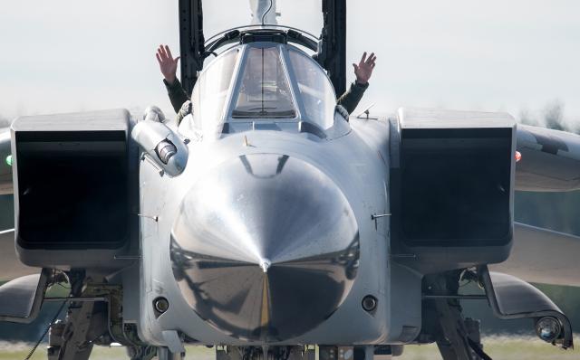 FILED - 08 October 2018, Mecklenburg-Western Pomerania, Laage: The pilot of a Tornado fighter jet from Air Force Wing 33 in Buechel raises his hands in the air after landing at the air base of Tactical Air Force Wing 73 "Steinhoff" in Rostock-Laage. As the rift with the United States widens, a long-dormant debate has returned in the halls of European power: Does the continent need its own nuclear umbrella?. Photo: Rainer Jensen/dpa