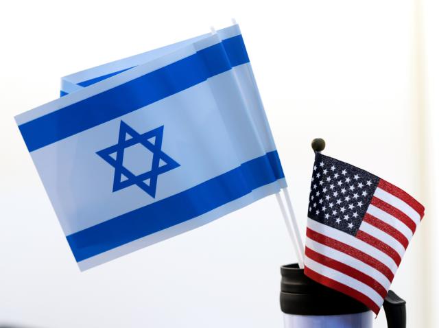 FILED - 18 March 2016, Saxony, Leipzig: National flags of Israel and the United States pictured at the book fair in Leipzig. Photo: Jens Kalaene/dpa-Zentralbild/dpa