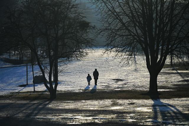 02 February 2026, Bavaria, Munich: People walk through the partially snow-covered Olympic Park. Photo: Malin Wunderlich/dpa