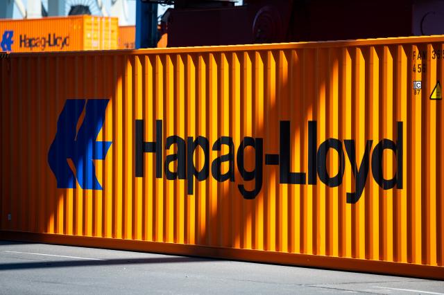 FILED - 02 May 2024, Hamburg: A container bearing the Hapag-Lloyd logo lies in Hamburg's Burchardkai harbor. Photo: Jonas Walzberg/dpa