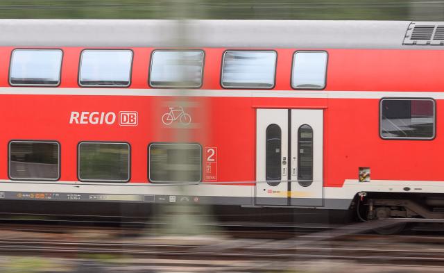FILED - 16 May 2018, Baden-Württemberg, Stuttgart: A Deutsche Bahn regional train drives in Stuttgart. Photo: Sebastian Gollnow/dpa