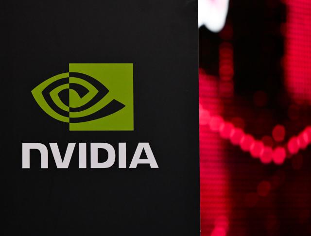 04 February 2026, Bavaria, Munich: The NVIDIA logo is seen during a press conference at the opening of Telekom and NVIDIA's AI factory "Industrial AI Cloud". According to the companies, the data center is one of the largest AI factories in Europe. Photo: Sven Hoppe/dpa