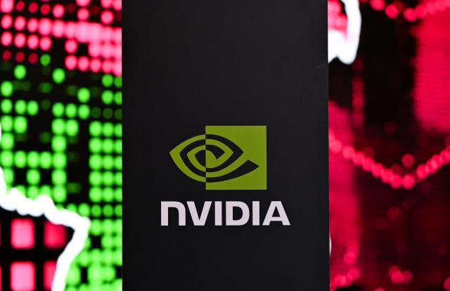 04 February 2026, Bavaria, Munich: The NVIDIA logo is seen during a press conference at the opening of Telekom and NVIDIA's AI factory "Industrial AI Cloud". According to the companies, the data center is one of the largest AI factories in Europe. Photo: Sven Hoppe/dpa