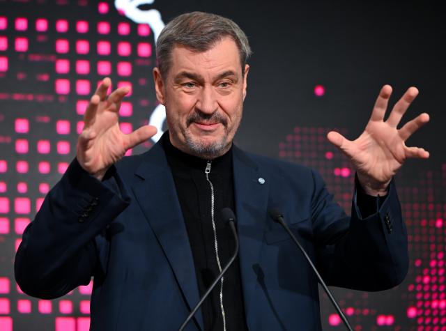 04 February 2026, Bavaria, Munich: Bavarian Minister President Markus Soeder takes part in a press conference during the opening of Telekom and NVIDIA's "Industrial AI Cloud" AI factory. Photo: Sven Hoppe/dpa