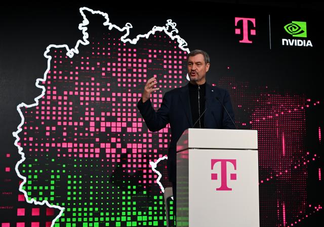04 February 2026, Bavaria, Munich: Bavarian Minister President Markus Soeder takes part in a press conference during the opening of Telekom and NVIDIA's "Industrial AI Cloud" AI factory. Photo: Sven Hoppe/dpa