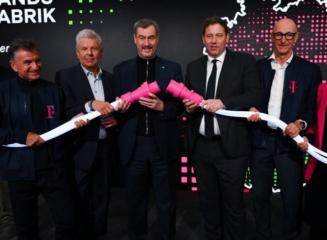 04 February 2026, Bavaria, Munich: erri Abolhassan, CEO of Deutsche Telekom AG, Dieter Reiter, Lord Mayor of Munich, Markus Soeder, Minister President of Bavaria, Lars Klingbeil, German Minister of Finance, and Tim Hoettges, CEO of Deutsche Telekom AG, attend the opening of Telekom and NVIDIA's "Industrial AI Cloud" AI factory. Photo: Sven Hoppe/dpa