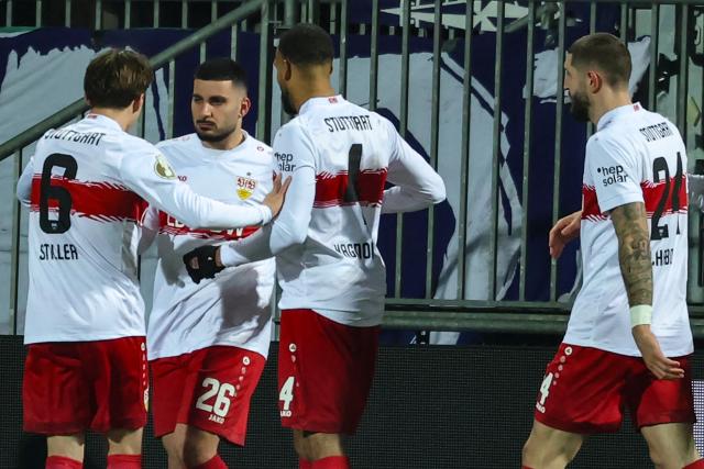 04 February 2026, Schleswig-Holstein, Kiel: Stuttgart's Deniz Undav (2nd L) celebrates scoring his side's first goal with teammates 
Angelo Stiller (L), Josha Vagnoman (2nd R) and Jeff Chabot (R) during the German DFB Cup quarterfinal soccer match between Holstein Kiel and VfB Stuttgart at Holstein Stadium. Photo: Christian Charisius/dpa - IMPORTANT NOTICE: DFL and DFB regulations prohibit any use of photographs as image sequences and/or quasi-video.