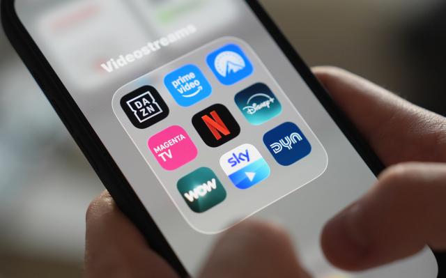 ILLUSTRATION - 26 November 2025, Hamburg: The app icons for Dazn, Amazon Prime, Paramount+, and Magenta TV, as well as Netflix, Disney+, Wow, Sky Go, and Dyn can be seen on a smartphone screen in the "Video Streams" folder. The German government plans to require streaming platforms and television broadcasters operating in Germany, including Netflix, Amazon Prime and Disney+, to invest in European films to support the struggling German film industry. Photo: Marcus Brandt/dpa