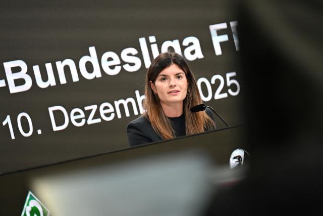 FILED - 10 December 2025, Hesse, Frankfurt/Main: Former German footballers Katharina Kiel speaks on the podium at a press conference during the founding of the German women's football league organization (FBL) at Deutsche Bank Park. Photo: Michael Brandt/dpa