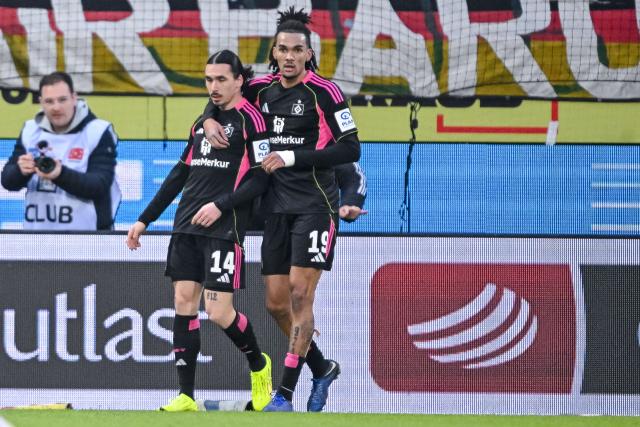 07 February 2026, Baden-Wuerttemberg, Heidenheim: Hamburger's Rayan Philippe (R) celebrates scoring his side's second goal with teammate Damion Downs during the German Bundesliga soccer match between 1. FC Heidenheim and Hamburger SV at Voith Arena. Photo: Harry Langer/dpa - WICHTIGER HINWEIS: Gemäß den Vorgaben der DFL Deutsche Fußball Liga bzw. des DFB Deutscher Fußball-Bund ist es untersagt, in dem Stadion und/oder vom Spiel angefertigte Fotoaufnahmen in Form von Sequenzbildern und/oder videoähnlichen Fotostrecken zu verwerten bzw. verwerten zu lassen.