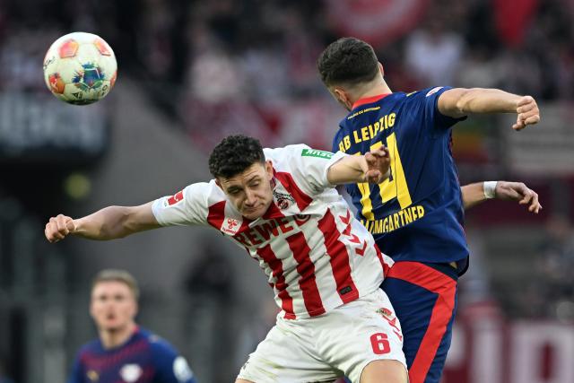 08 February 2026, North Rhine-Westphalia, Cologne: Cologne's Eric Martel and Leipzig's Christoph Baumgartner battle for the ball during the German Bundesliga soccer match between 1.FC Cologne and RB Leipzig at RheinEnergieStadion. Photo: Federico Gambarini/dpa - IMPORTANT NOTE: In accordance with the regulations of the DFL German Football League and the DFB German Football Association, it is prohibited to utilize or have utilized photographs taken in the stadium and/or of the match in the form of sequential images and/or video-like photo series.