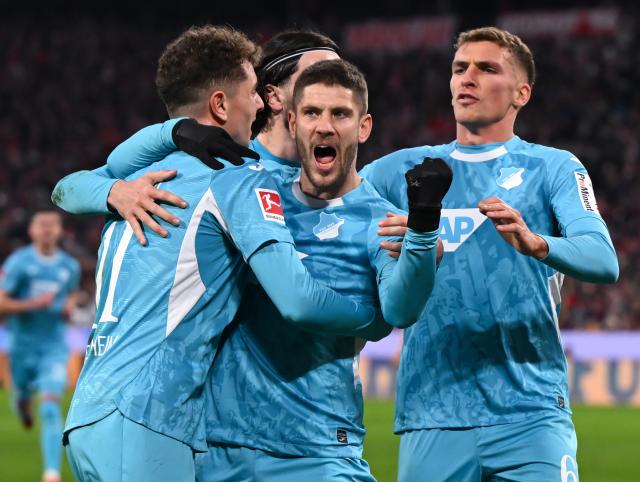 08 February 2026, Bavaria, Munich: Hoffenheim's Andrej Kramaric celebrates scoring his side's first goal with his teammates during the German Bundesliga soccer match between Bayern Munich and TSG 1899 Hoffenheim at the Allianz Arena. Photo: Sven Hoppe/dpa - IMPORTANT NOTE: In accordance with the regulations of the DFL German Football League and the DFB German Football Association, it is prohibited to utilize or have utilized photographs taken in the stadium and/or of the match in the form of sequential images and/or video-like photo series.