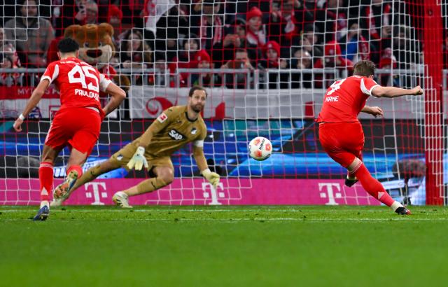 08 February 2026, Bavaria, Munich: Bayern Munich's Harry Kane scores his side's second goal during the German Bundesliga soccer match between Bayern Munich and TSG 1899 Hoffenheim at the Allianz Arena. Photo: Sven Hoppe/dpa - IMPORTANT NOTE: In accordance with the regulations of the DFL German Football League and the DFB German Football Association, it is prohibited to utilize or have utilized photographs taken in the stadium and/or of the match in the form of sequential images and/or video-like photo series.