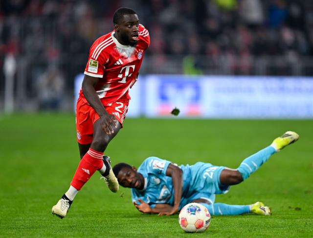 08 February 2026, Bavaria, Munich: Bayern Munich's Dayot Upamecano (L) and Hoffenheim's Bazoumana Toure battle for the ball during the German Bundesliga soccer match between Bayern Munich and TSG 1899 Hoffenheim at the Allianz Arena. Photo: Sven Hoppe/dpa - IMPORTANT NOTE: In accordance with the regulations of the DFL German Football League and the DFB German Football Association, it is prohibited to utilize or have utilized photographs taken in the stadium and/or of the match in the form of sequential images and/or video-like photo series.