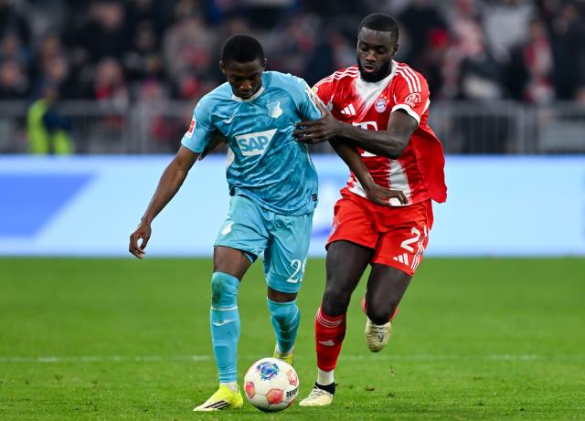 08 February 2026, Bavaria, Munich: Bayern Munich's Dayot Upamecano (L) and Hoffenheim's Bazoumana Toure battle for the ball during the German Bundesliga soccer match between Bayern Munich and TSG 1899 Hoffenheim at the Allianz Arena. Photo: Sven Hoppe/dpa - IMPORTANT NOTE: In accordance with the regulations of the DFL German Football League and the DFB German Football Association, it is prohibited to utilize or have utilized photographs taken in the stadium and/or of the match in the form of sequential images and/or video-like photo series.