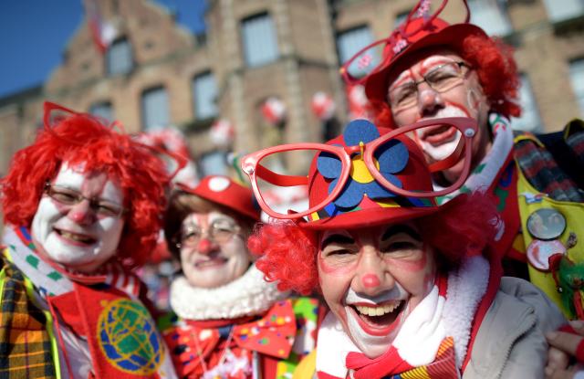 FILED - 16 February 2015, North Rhine-Westphalia, Duesseldorf: Clowns are pictured during the Rose Monday parade in Duesseldorf. Carnival celebrations in the German city of Duesseldorf are gearing up to be the biggest in 20 years, unbowed by ongoing legal proceedings targeting a local float designer for his satirical depictions of President Vladimir Putin and the Russian Army. Photo: Federico Gambarini/dpa