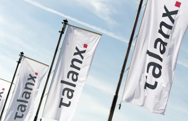 FILED - 11 May 2016, Hanover: Flags of Talanx AG fly at 2016's General Meeting of the insurance group. Profits for German insurance group Talanx were up by 25% in 2025, rising to a record ·2.48 billion ($2.95 billion) despite claims from the devastating wildfires raging in California at the start of that year, the firm said on Tuesday. Photo: Sebastian Gollnow/dpa