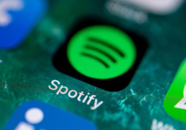 FILED - 21 June 2019, Baden-Wuerttemberg, Stuttgart: The Spotify music service app is shown on the display of an iPhone. Photo: Fabian Sommer/dpa