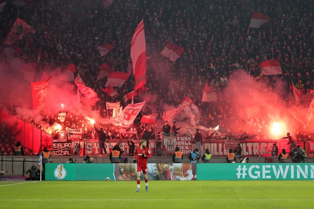 10 February 2026, Berlin: Fans light flares during the German DFB Cup quarter-final soccer match between Hertha BSC and SC Freiburg at Olympiastadion. Photo: Andreas Gora/dpa