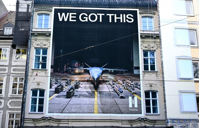 11 February 2026, Bavaria, Munich: A poster for the arms manufacturer Helsing hangs on a wall near the Hotel Bayerischer Hof. The 62nd Munich Security Conference (MSC) takes place from February 13 to 15, 2026, at the Hotel Bayerischer Hof in Munich. Photo: Sven Hoppe/dpa - ATTENTION: editorial use only in connection with the latest coverage and only if the credit mentioned above is referenced in full
