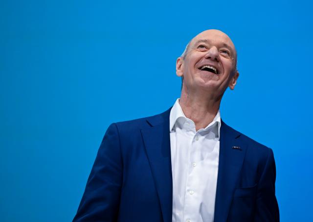 12 February 2026, Bavaria, Munich: Roland Busch, CEO of Siemens AG, stands on stage at the Olympiahalle during the Annual General Meeting of Siemens AG. Photo: Sven Hoppe/dpa