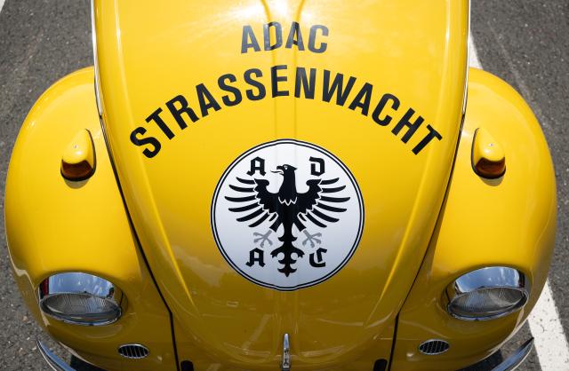 FILED - 15 August 2024, Saxony, Zwickau: A VW Beetle with an ADAC road patrol logo in the old layout stands at the start of the Sachsen Classic in Zwickau. Photo: Hendrik Schmidt/dpa