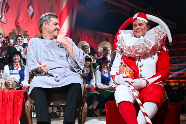 12 February 2026, Baden-Wuerttemberg, Stockach: Bavarian Minister-President Markus Soeder (L) sits as the defendant before the Fools' Court in Stockach. Every year, the Fools' Court in Stockach puts a politician in their place. Photo: Felix Kästle/dpa