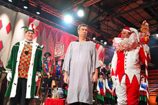 12 February 2026, Baden-Wuerttemberg, Stockach: Bavarian Minister-President Markus Soeder (2nd L) stands trial before the Fools' Court in Stockach. Every year, the Fools' Court in Stockach puts a politician in their place. Photo: Felix Kästle/dpa