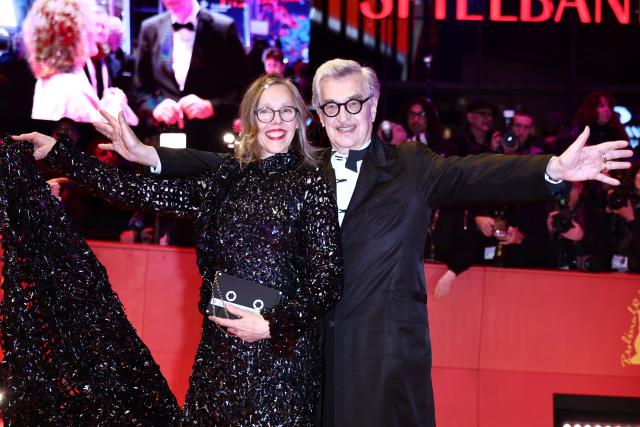 12 February 2026, Berlin: Jury president of the Berlinale Wim Wenders (R) and his wife Donata stand on the red carpet in front of the Berlinale Palast, on the opening night of the 76th Berlin International Film Festival. Photo: Christoph Soeder/dpa
