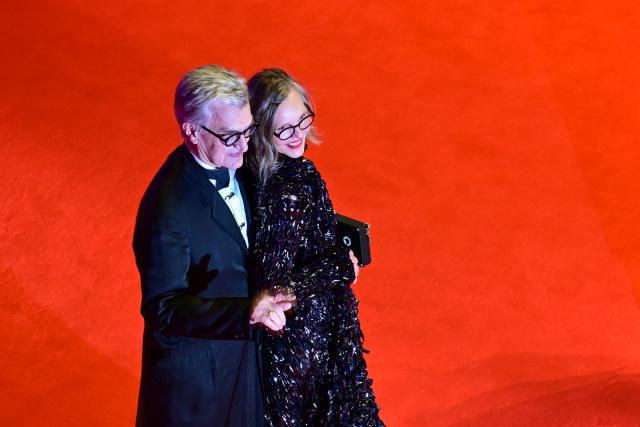 12 February 2026, Berlin: Jury president of the Berlinale Wim Wenders (L) and his wife Donata stand on the red carpet in front of the Berlinale Palast, on the opening night of the 76th Berlin International Film Festival. Photo: Sebastian Christoph Gollnow/dpa