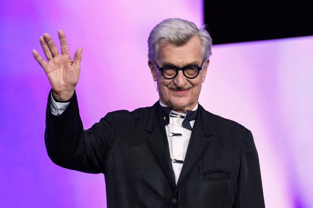 12 February 2026, Berlin: President of the Berlinale jury Wim Wenders waves to the audience on the opening night of the 76th Berlin International Film Festival, before the premiere of the opening film "No Good Men" at the Berlinale Palast. Photo: Soeren Stache/dpa