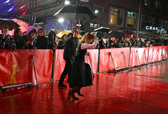 12 February 2026, Berlin: German actress Karoline Herfurth walks the red carpet in the rain, on the opening night of the 76th Berlin International Film Festival. Photo: Elisa Schu/dpa