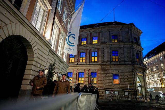 13 February 2026, Bavaria, Munich: The windows of the Ukraine House next to the Hotel Bayerischer Hof are lit in the national colors of Ukraine ahead of the 62nd Munich Security Conference (MSC). More than 60 heads of state and government are expected to attend the world's leading expert forum on security policy - more than ever before. Photo: Kay Nietfeld/dpa