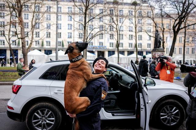 dpatop - 13 February 2026, Bavaria, Munich: Police dog Luna is photographed and filmed during a media event at the 62nd Munich Security Conference (MSC) in front of the Hotel Bayrischer Hof. Photo: Kay Nietfeld/dpa