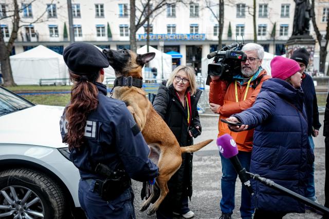 13 February 2026, Bavaria, Munich: Police dog Luna is photographed and filmed during a media event at the 62nd Munich Security Conference in front of the Bayerischer Hof hotel. Photo: Kay Nietfeld/dpa