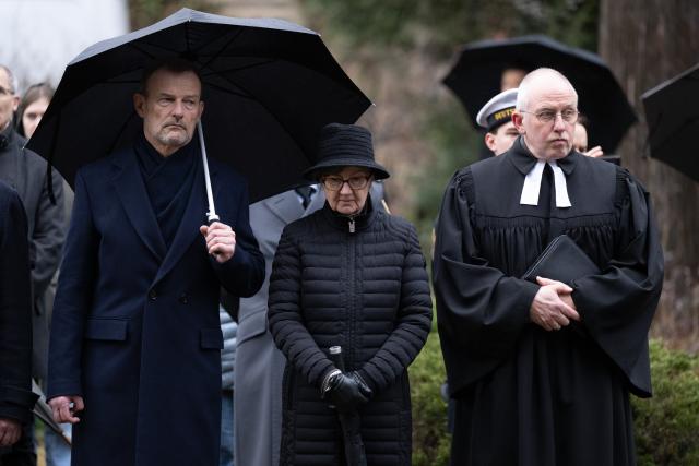 13 February 2026, Saxony, Dresden: (L-R) Joerg Scheibe, Vice President of the Saxony State Parliament, Andrea Dombois, former Vice President of the State Parliament, and Military Dean Klaus Kaiser stand together during a memorial service at North Cemetery. On February 13-14, 1945, Allied bombers destroyed Dresden's city center on the Elbe, killing up to 25,000 people. Photo: Sebastian Kahnert/dpa