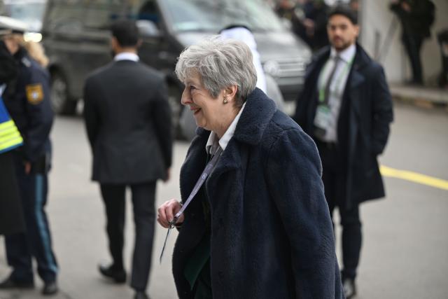 13 February 2026, Bavaria, Munich: Theresa May, former Prime Minister of the United Kingdom, arrives at the Bavarian Court for the 62nd Munich Security Conference, which will host over 60 heads of state and government-the highest number ever at the world's leading security policy meeting. Photo: Felix Hörhager/dpa