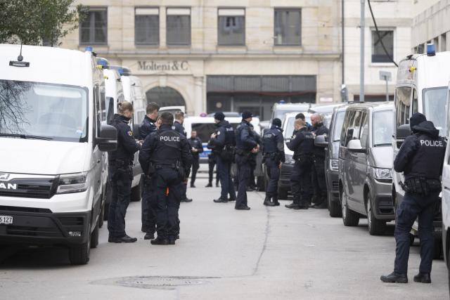 13 February 2026, Bavaria, Munich: Police officers stand at an entrance of the Bavarian Court, the venue for the 62nd Munich Security Conference, which will host over 60 heads of state and government-the highest number ever at the world's leading security policy meeting. Photo: Marijan Murat/dpa