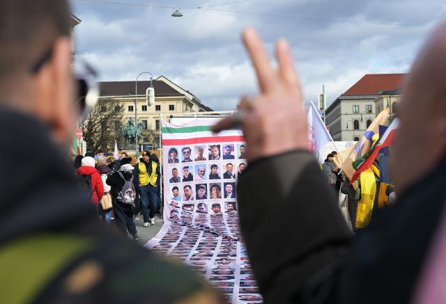 13 February 2026, Bavaria, Munich: People demonstrate at Odeonsplatz against human rights violations in Iran and call for regime change by the Iranian people during the weekend of the Munich Security Conference, where numerous protests - including larger rallies against Iran's regime - are expected alongside the summit. Photo: Malin Wunderlich/dpa