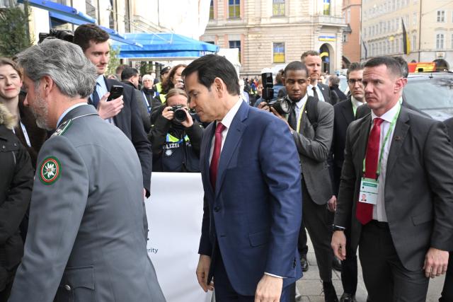 13 February 2026, Bavaria, Munich: US Secretary of State Marco Rubio (C) arrives at the Bayerischer Hof for the 62nd Munich Security Conference, which will host over 60 heads of state and government-the highest number ever at the world's leading security policy meeting. Photo: Felix Hörhager/dpa