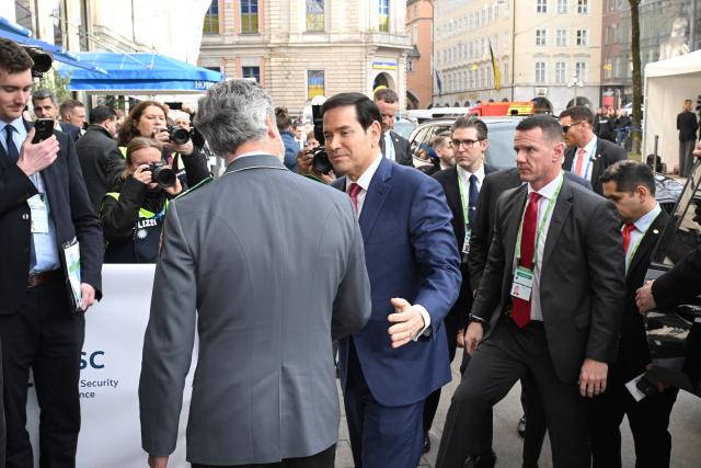 13 February 2026, Bavaria, Munich: US Secretary of State Marco Rubio (C) arrives at the Bayerischer Hof for the 62nd Munich Security Conference, which will host over 60 heads of state and government-the highest number ever at the world's leading security policy meeting. Photo: Felix Hörhager/dpa