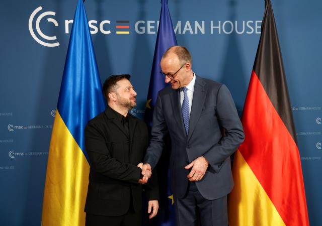 13 February 2026, Bavaria, Munich: Ukrainian President Volodymyr Zelensky (L) and German Chancellor Friedrich Merz meet for bilateral talks on the sidelines of the 62nd Munich Security Conference at the Bayerischer Hof Hotel. Photo: Michaela Stache/AFP POOL/dpa