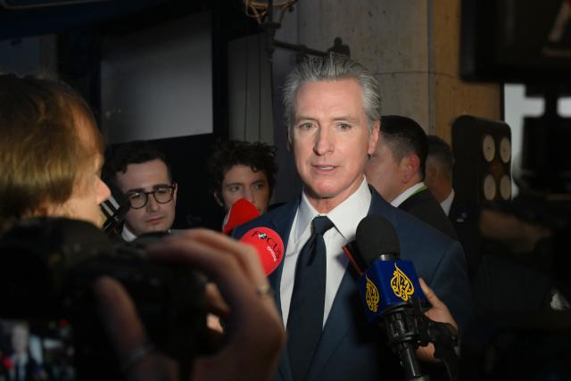 13 February 2026, Bavaria, Munich: Gavin Newsom, Governor of California speaks to the press on the sidelines of the 62nd Munich Security Conference at the Bayerischer Hof Hotel. Photo: Felix Hörhager/dpa