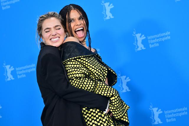 13 February 2026, Berlin: US Actress Haley Lu Richardson embraces German-American actress Zazie Beetz during the photocall for the film "Have Fun, Don't Die" at the 76th Berlin International Film Festival. Photo: Sebastian Gollnow/dpa