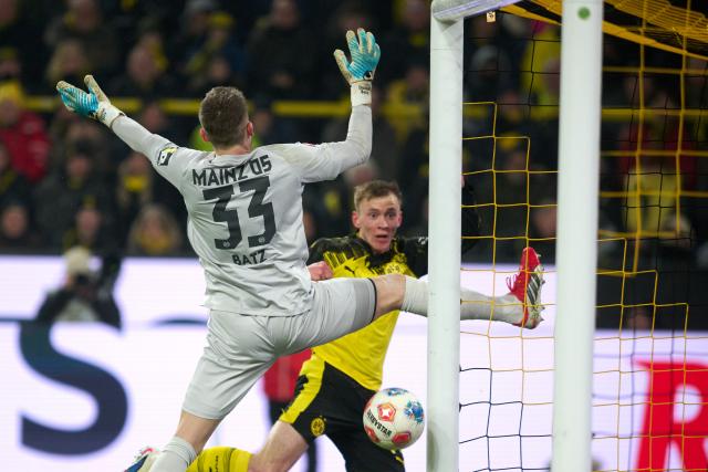 13 February 2026, North Rhine-Westphalia, Dortmund: Dortmund's Maximilian Beier scores his side's second goal during the German Bundesliga soccer match between Borussia Dortmund and FSV Mainz 05 at Sgina Iduna Park. Photo: Bernd Thissen/dpa - IMPORTANT NOTE: In accordance with the regulations of the DFL German Football League and the DFB German Football Association, it is prohibited to utilize or have utilized photographs taken in the stadium and/or of the match in the form of sequential images and/or video-like photo series.